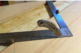 photo of framing square and a utility knife for marking stair cuts