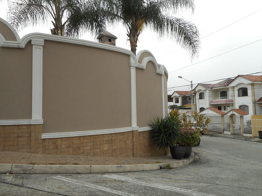 Decorative wall surrounding gated community